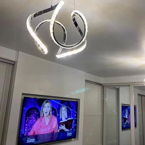 Backlit media wall with recessed TV and LED accent lighting